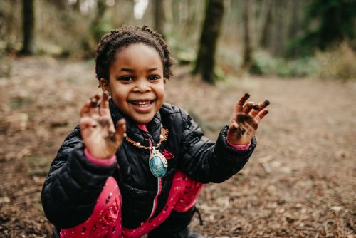 Child playing in mud.