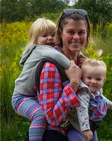 woman outside with her two children