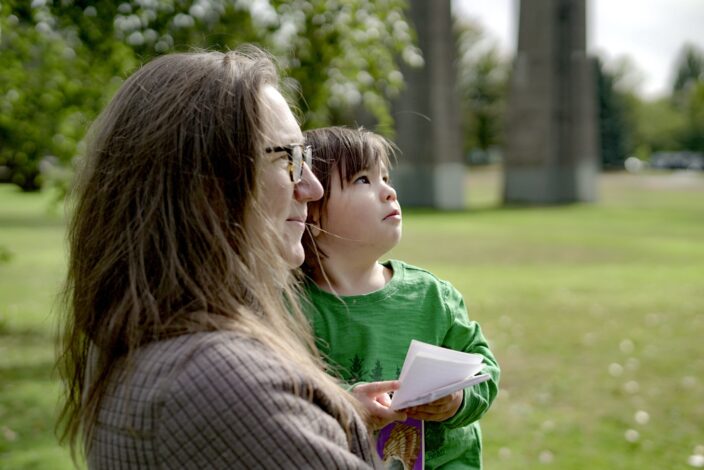 Adrienne and daughter looking up at the trees