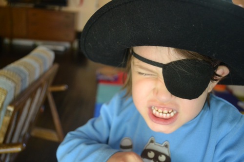 Kid with an eye patch and a pirate hat on