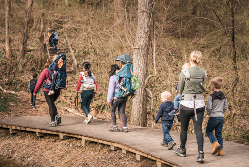 families hiking together on a trail