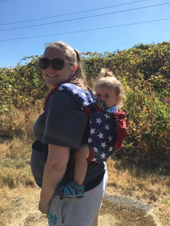 Pregnant mom babywearing and hiking