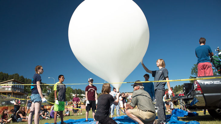 A team prepares to launch a practice NASA weather balloon on July 8, 2017, in Lead, South Dakota.