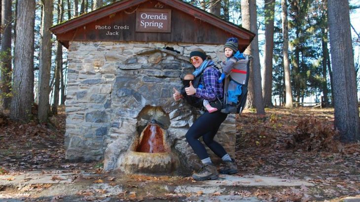 Love, Happiness & Friendship: Making Moving Easier by Carrie Wenzel for Hike it Baby (image of a mom with a kid in a frame carrier, and another tandem carried on the front by the Orenda Spring)