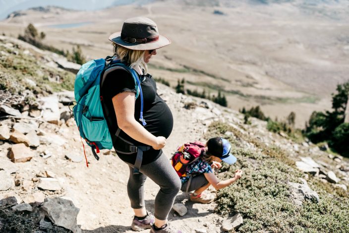 pregant mom hiking with a young child