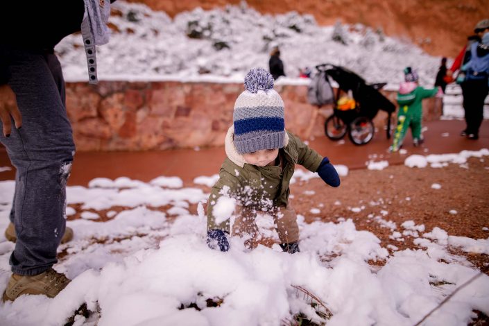 child playing in the snow