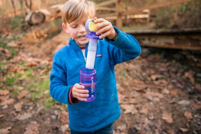 boy with water filtration bottle