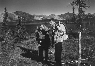 A black and white photo of the Murie's when they were young hikers