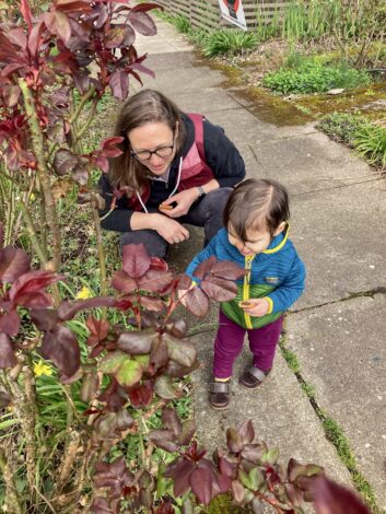 Adrienne and her daughter looking at flowers