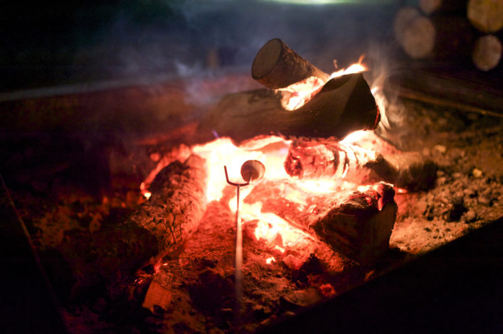 Nighttime Activities for Camping with Kids by Mary Flynn for Hike it Baby (image of a marshmallow roasting over a fire)