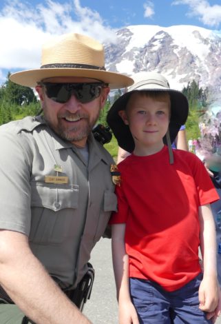 Ranger with his son in front of Mt. Rainier