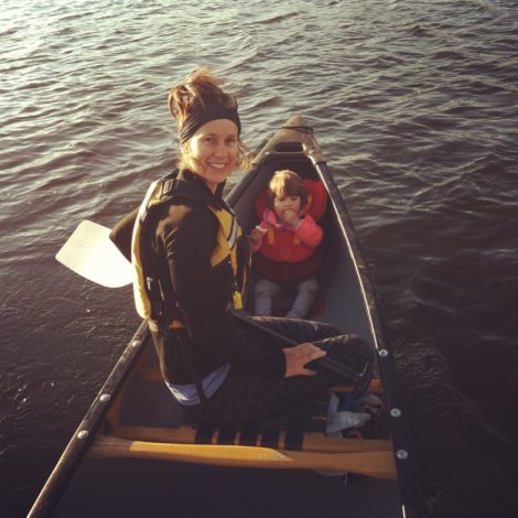 woman and small child in a canoe on a lake