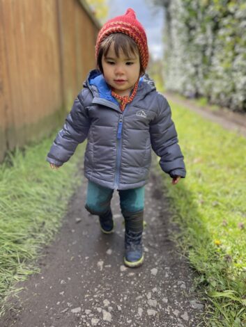Child walking in the spring weather
